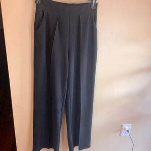 H&M Black pull on wide leg trousers with pockets.